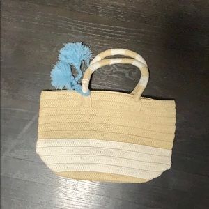 Altru straw hand bag with blue poms